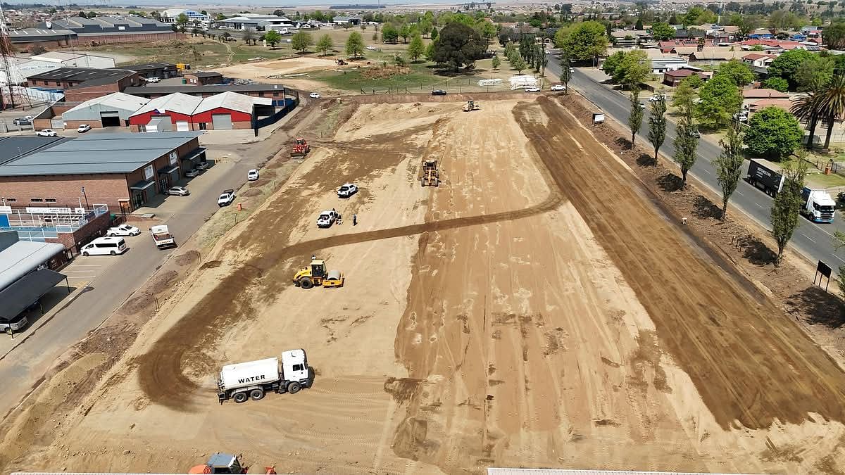 Aerial view of an Aquafleet truck on a vast earthworks project