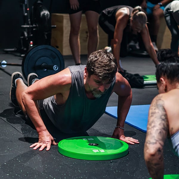 Athlete celebrating a personal record lift at CrossFit Ari