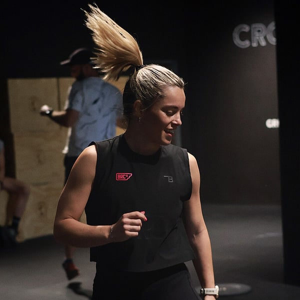Athletes high-fiving after completing a grueling workout at CrossFit Ari