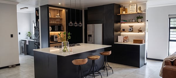 Luxury custom kitchen featuring precision cabinetry, Häfele fittings, and a pocket-door coffee station by Revival Space.