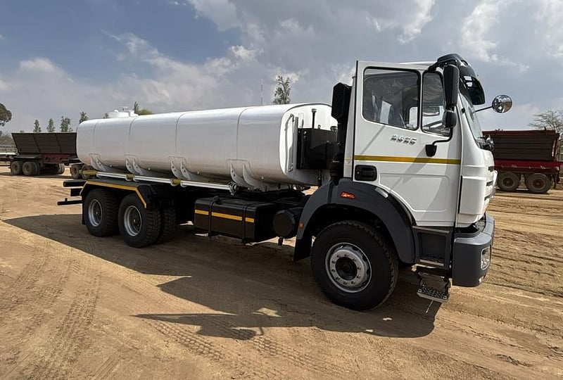A white Aquafleet water tanker on a construction site